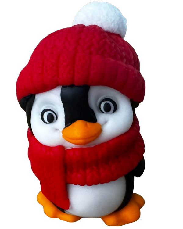 Edible decoration of sugar paste, penguin with scarf and red cap